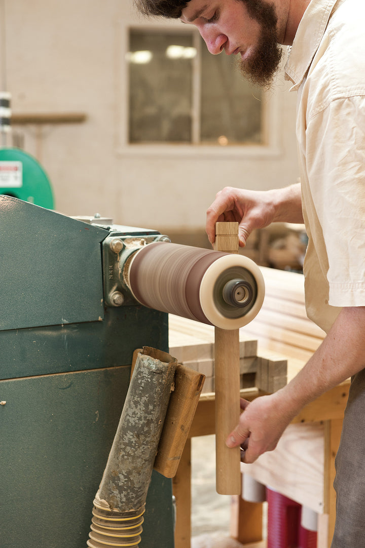 Amish craftsman making wood furniture